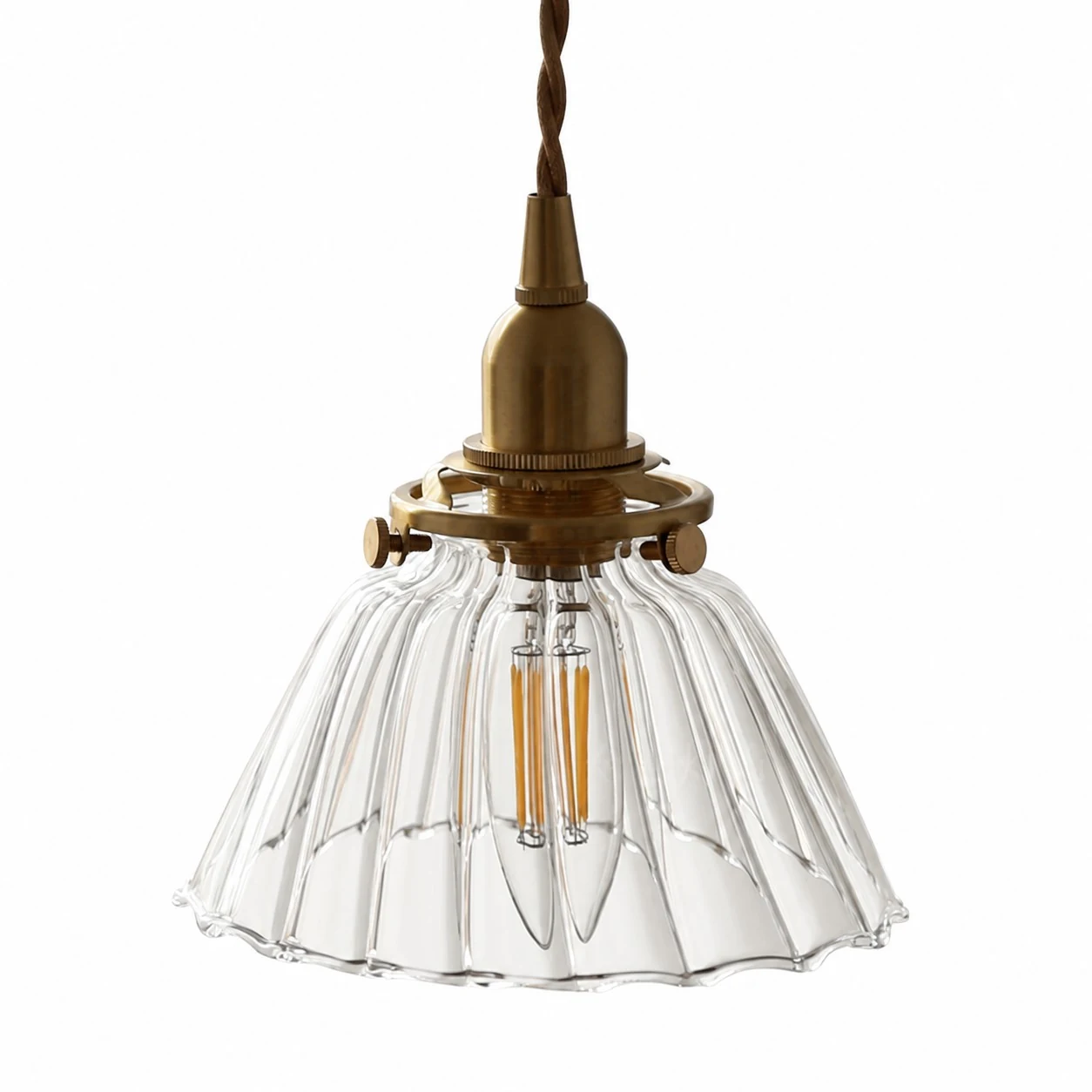 Clear ribbed glass pendant light with brass-toned holder