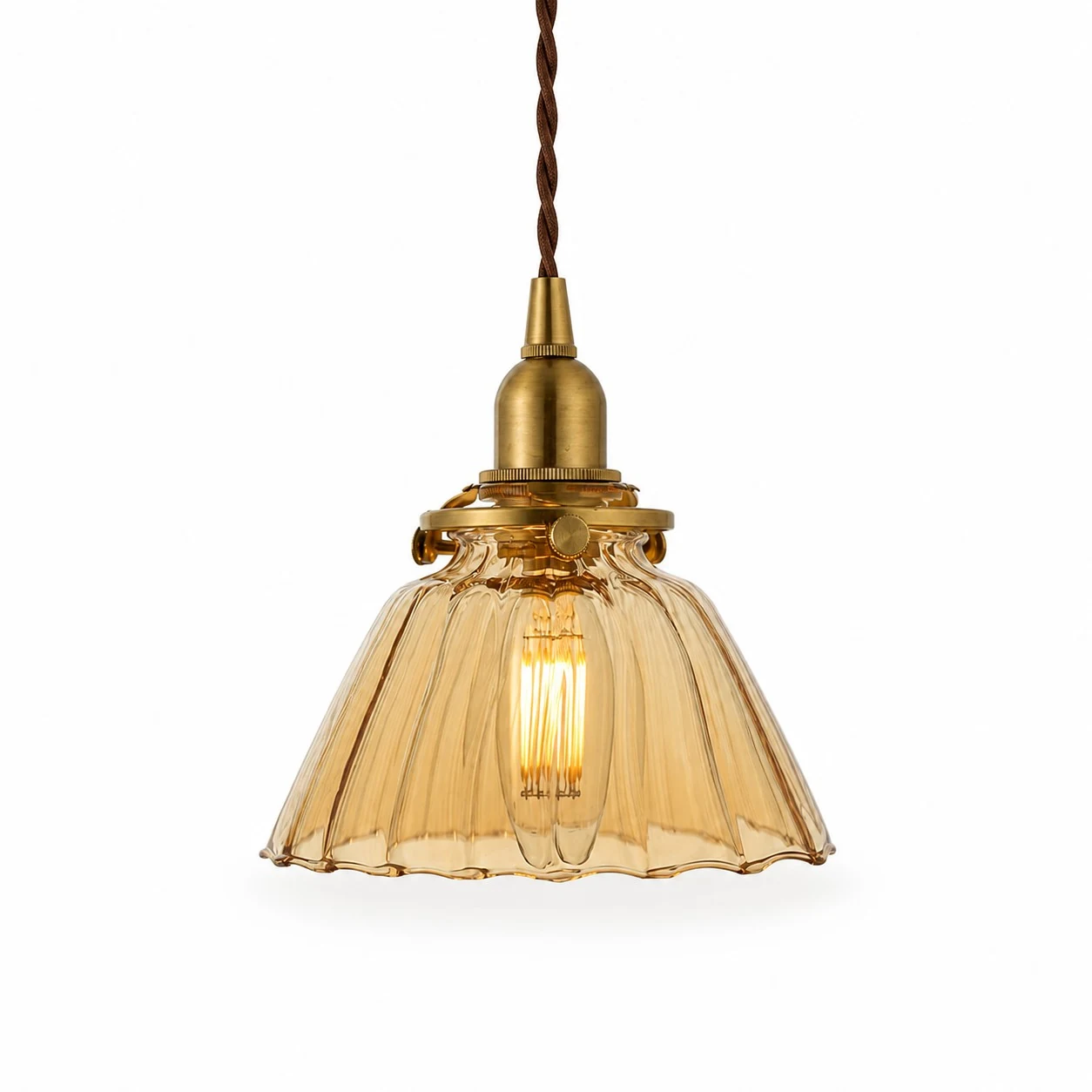 Amber ribbed glass pendant light with brass-toned holder