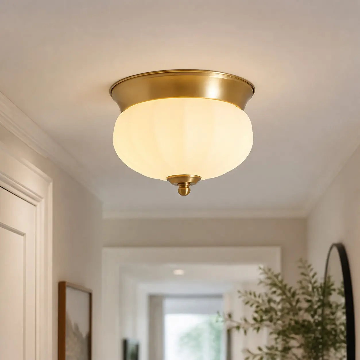 Integrated LED brass ceiling light installed in a hallway