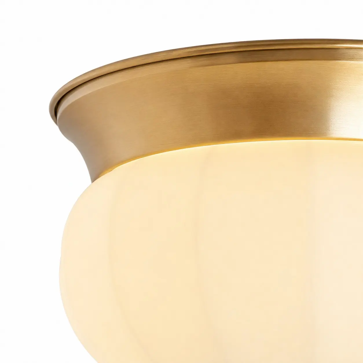 Close-up of the solid brass upper rim and opal glass shade