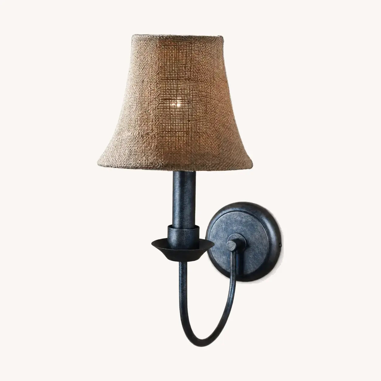 Antique finish wall sconce with coarse linen shade