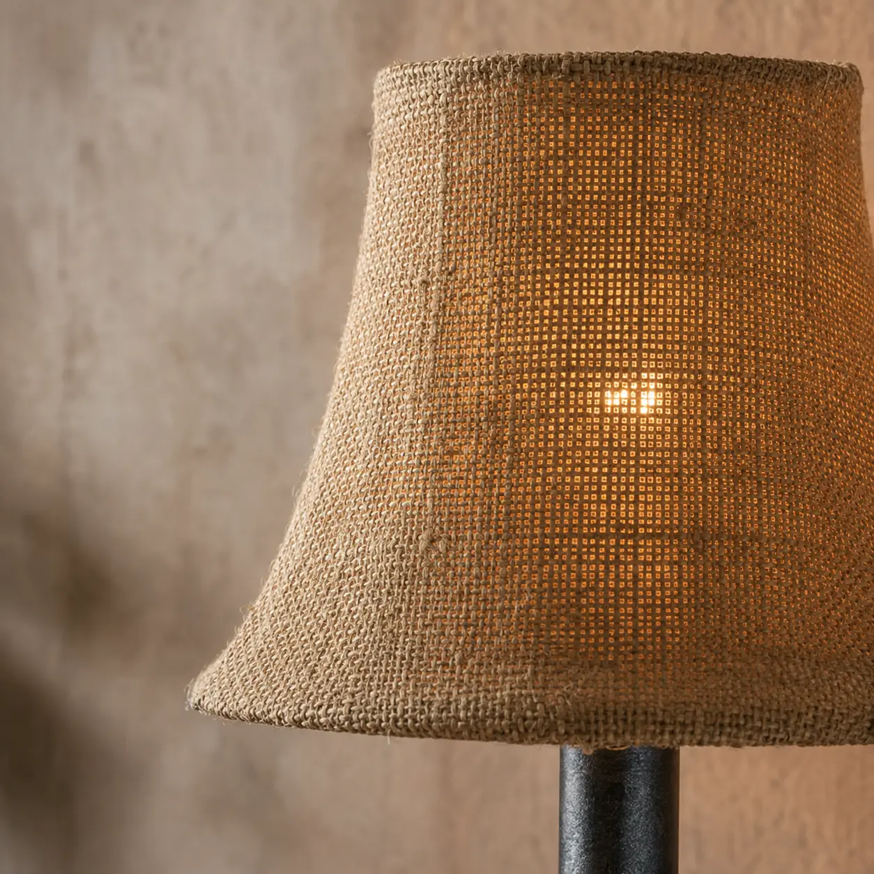 Close view of coarse linen shade texture and warm glow