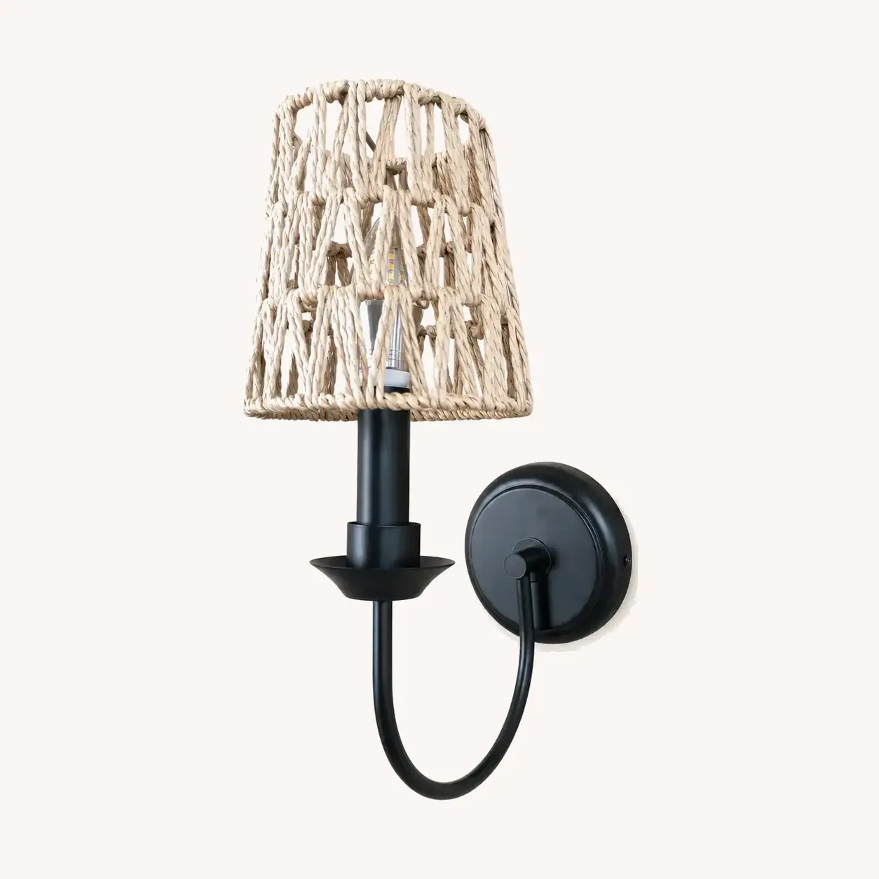 Matte black wall sconce with Style C open woven shade