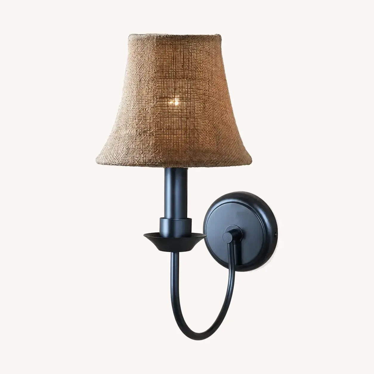 Matte black wall sconce with coarse linen shade