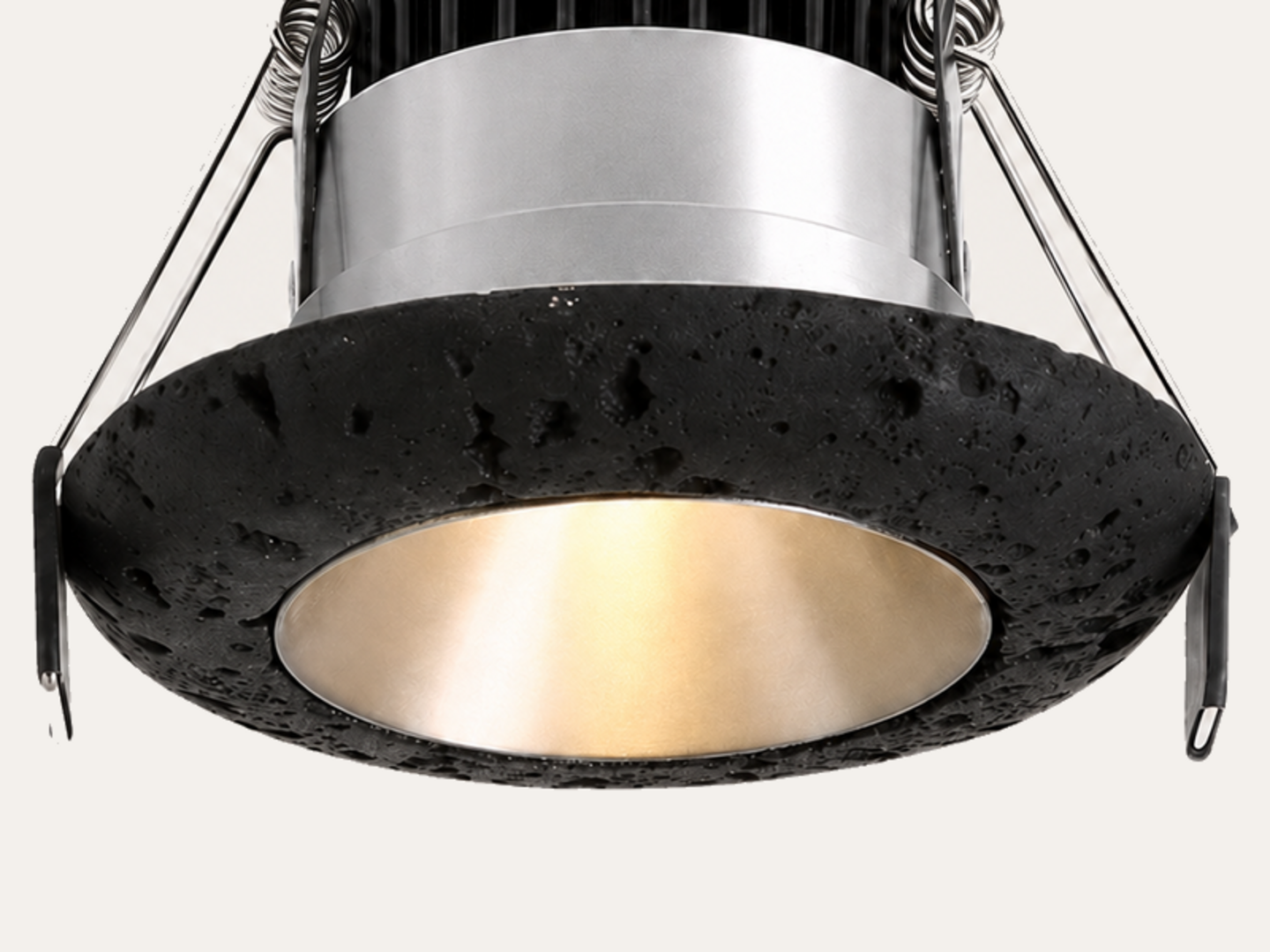 Close-up of porous black travertine downlight trim
