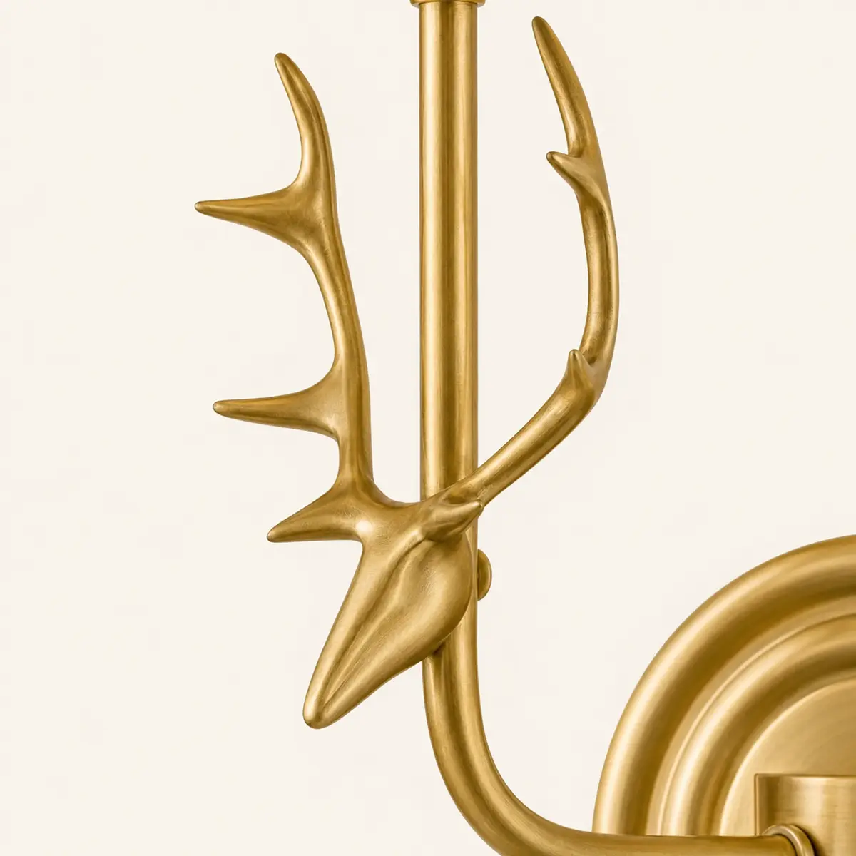 Close view of the sculpted deer head and antler branches