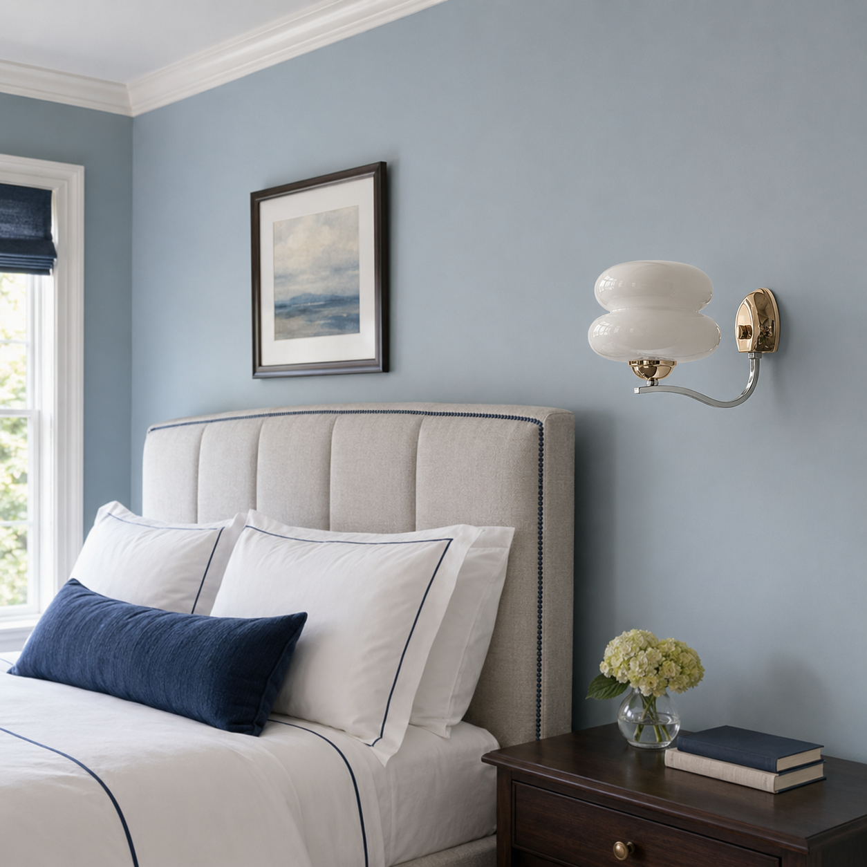 Cream white one-light wall sconce in an American bedroom