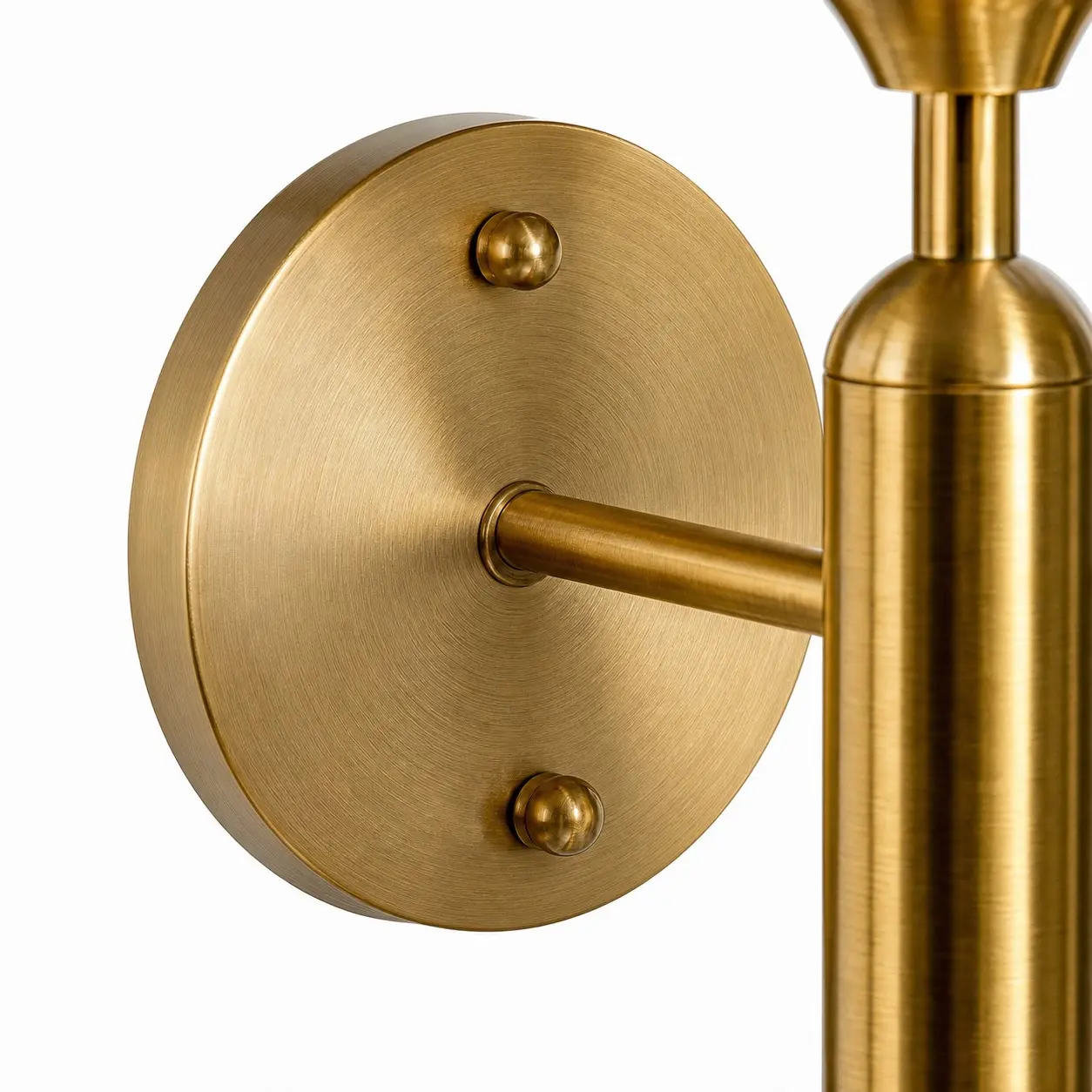 Close view of the antique brass wall plate and arm