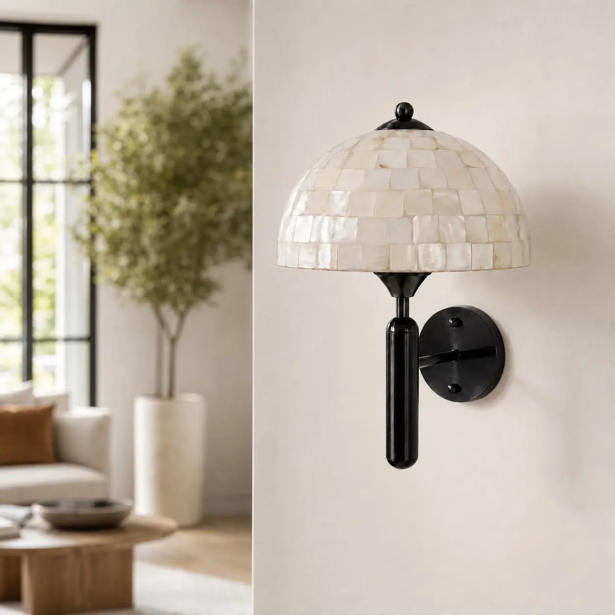 Matte black mother of pearl wall sconce in a modern living room