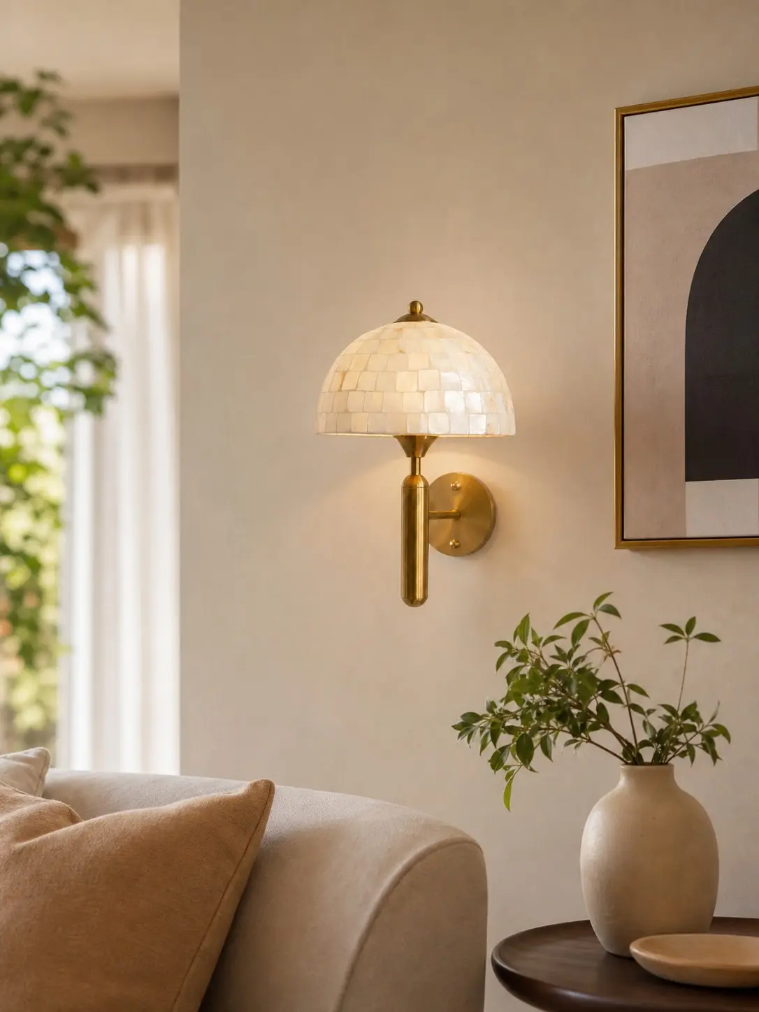 Antique brass mother of pearl wall sconce in a warm living room